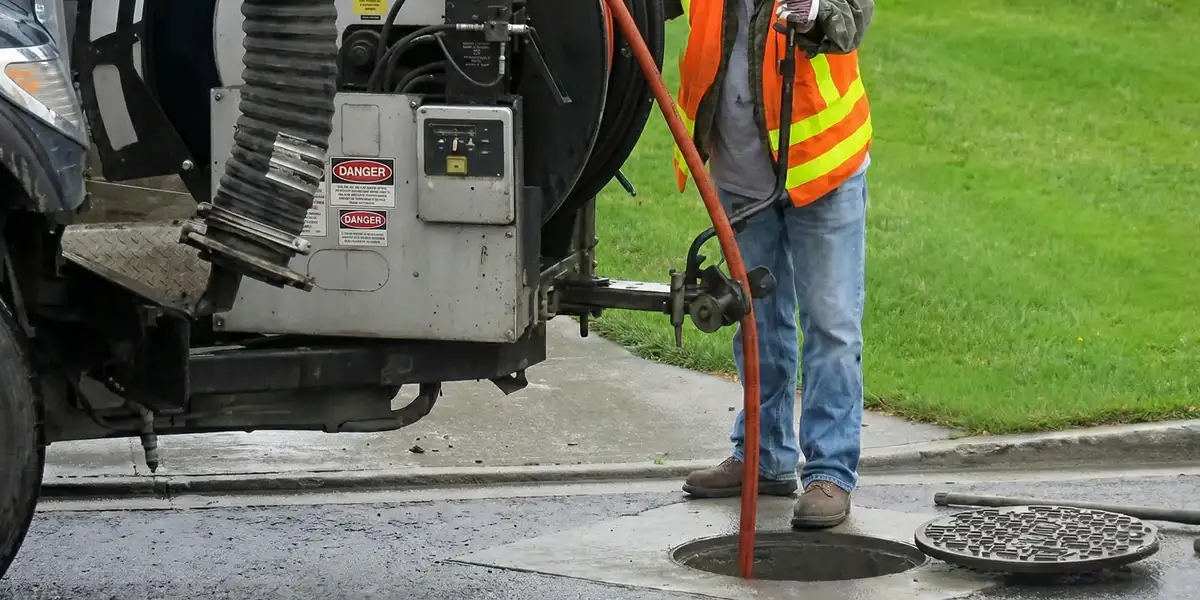 sewage clean up professionals using industrial equipment to remove contaminated wastewater in Erie, PA