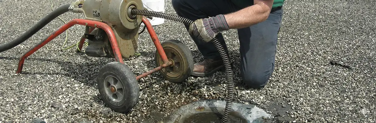 sewer rodding technician actively removing blockages from a sewer line in Erie, PA