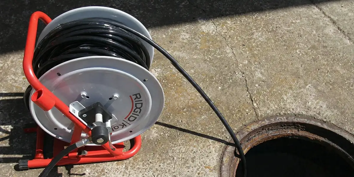sewer rodding equipment prepared to clear clogged sewer lines in Erie, PA
