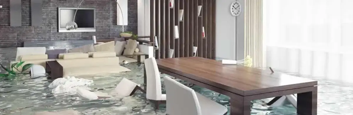 home interior affected by water damage with flooded floors and displaced furniture in Erie, PA